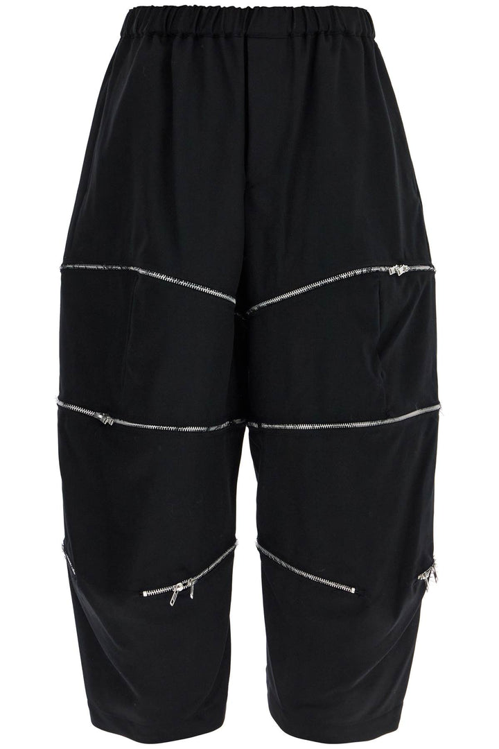 COMME DES GARCONS BLACK cropped pants with zip openings.