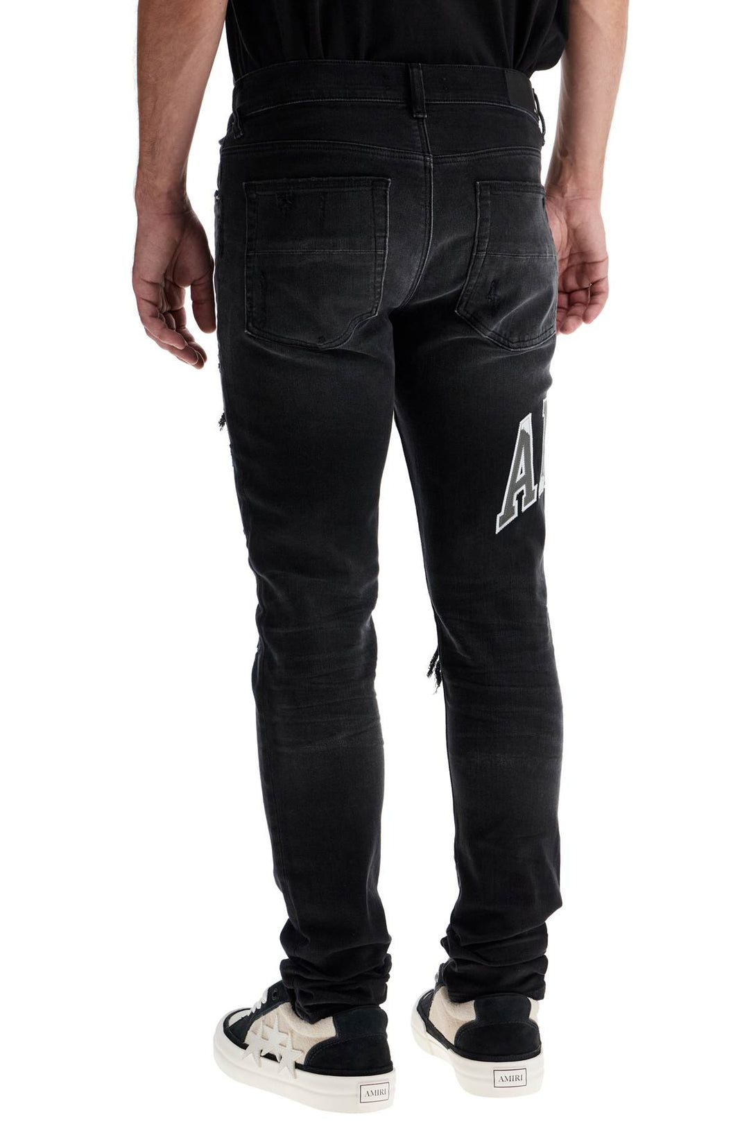 Amiri skinny jeans with varsity logo