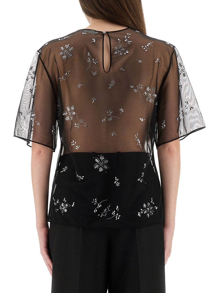 TRANSPARENT TOP WITH APPLICATIONS